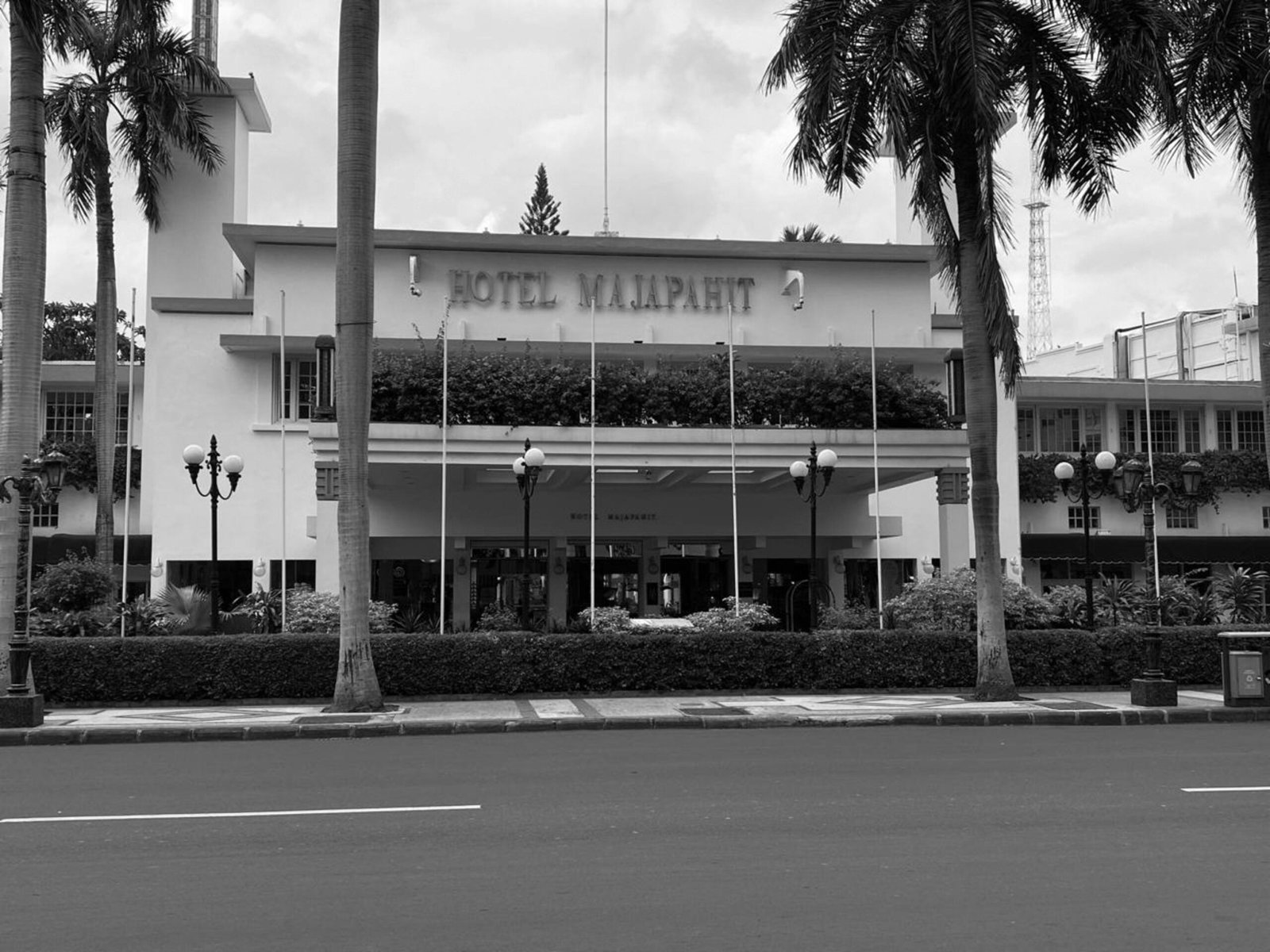 a black and white photo of a hotel in miami